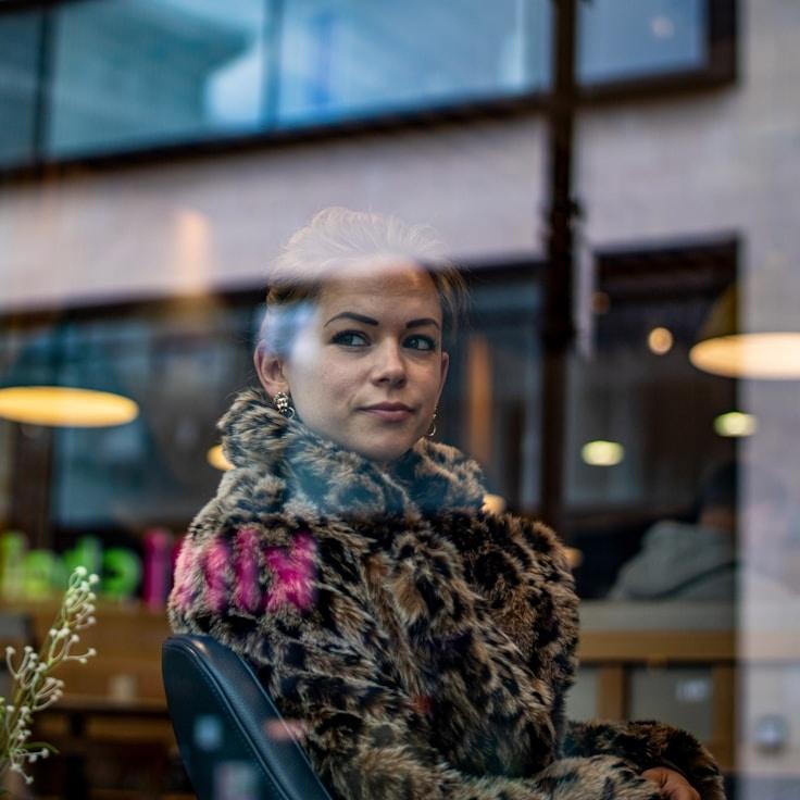 Kaveri Mehta, Lead Design Curator at Pebble Bright Pulse, reviewing corporate floral arrangements